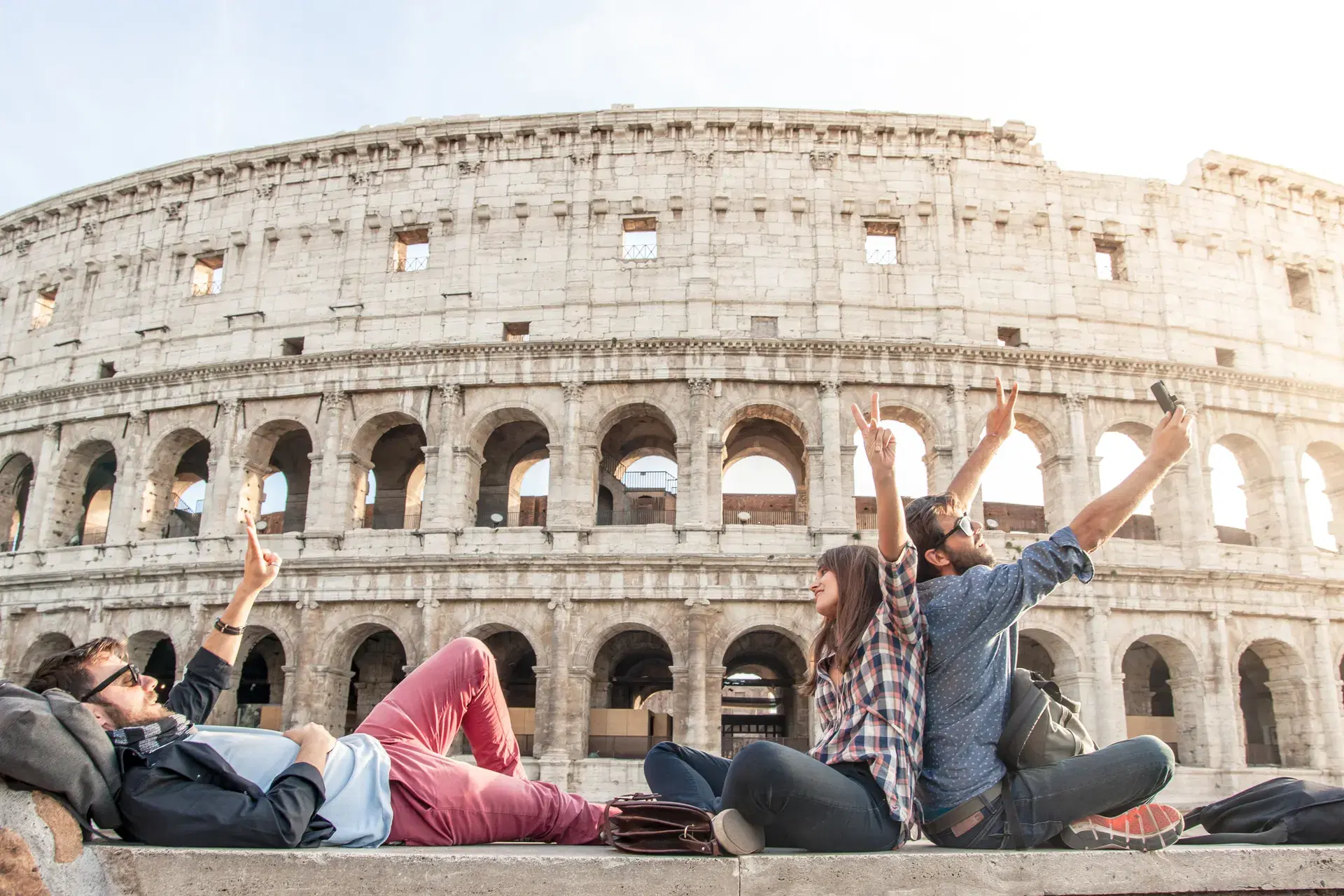 Travelers taking a selfie at the Colosseum